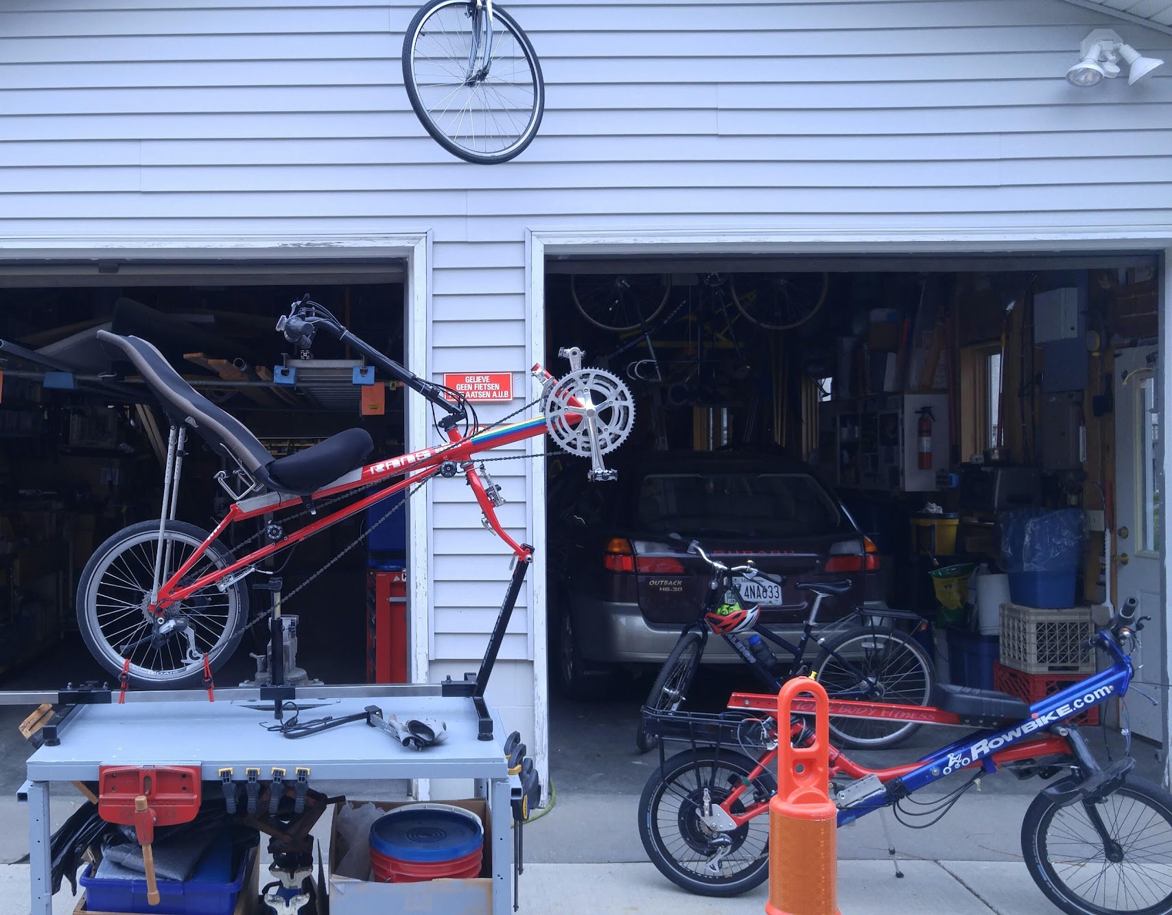 garage_apron_with_assortment_of_bikes_being_worked_on_photo
